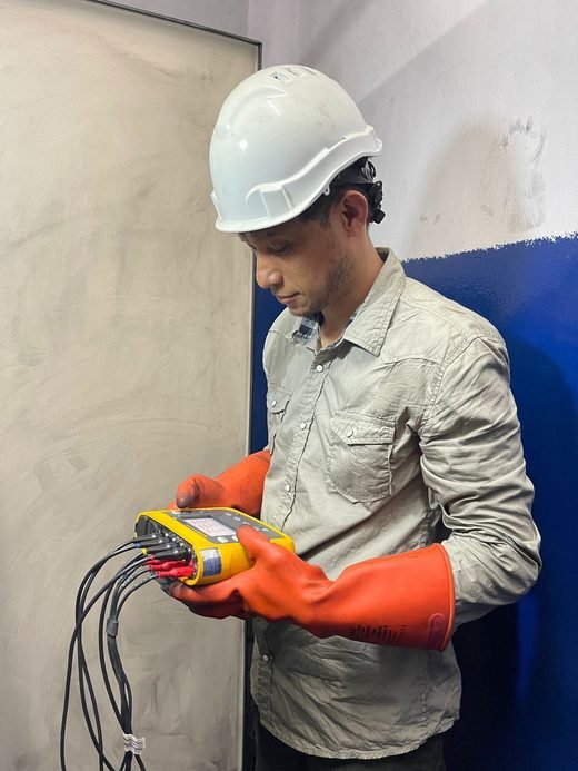 Engineer taking a power-quality reading on site